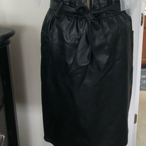 Faux leather black skirt with tie around the waist.